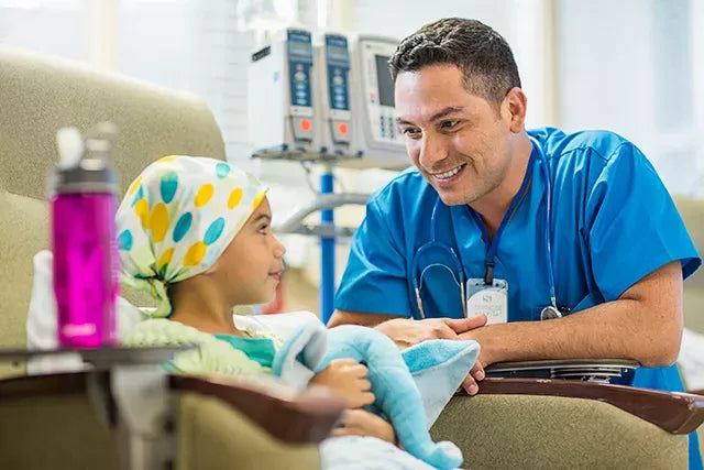 Nurse with a child patient in a hospital setting